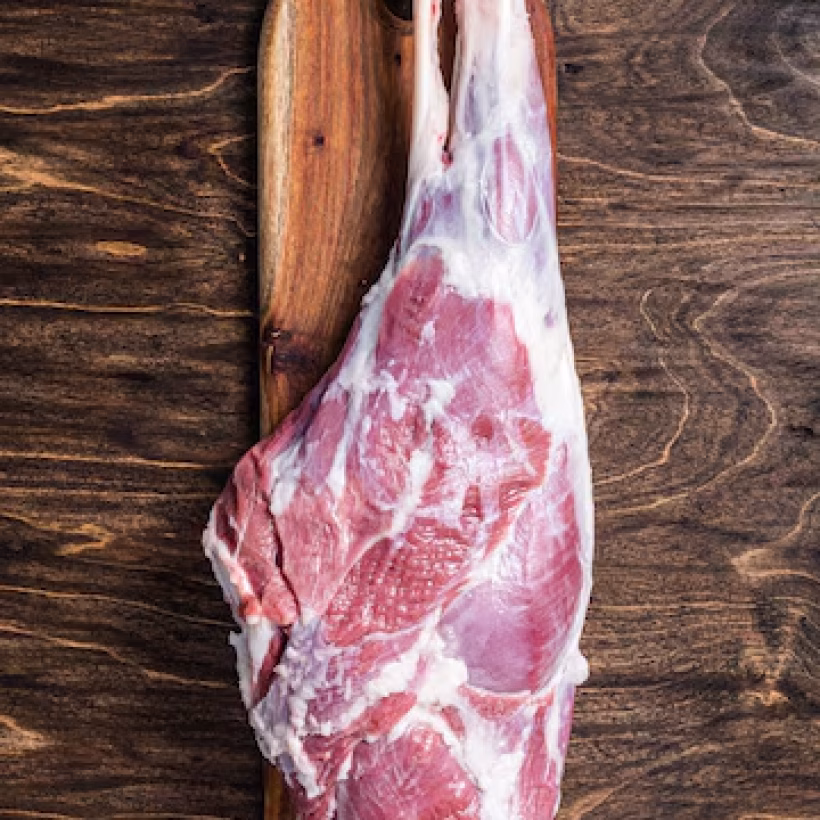 mutton-meat-raw-whole-lamb-leg-thigh-butcher-board-wooden-background-top-view_89816-40002